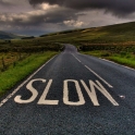 road-in-country-with-slow-sign.jpg